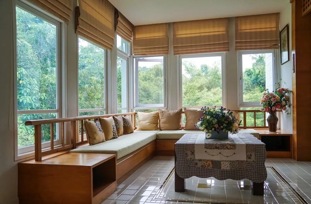 Roman blind lowered over a bay window seat