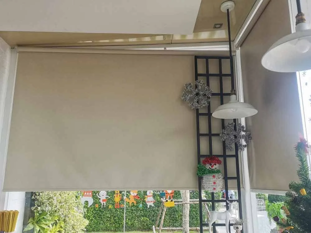 Blockout blind lowered to keep afternoon sun out of a room