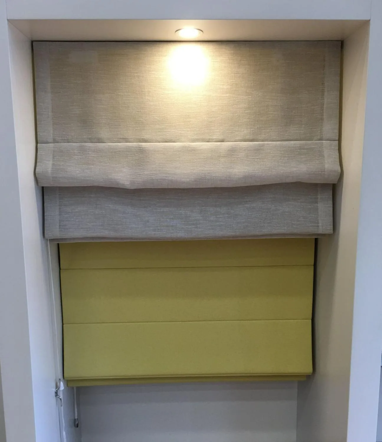 Roman blind fitted inside a window reveal in a Brisbane interior