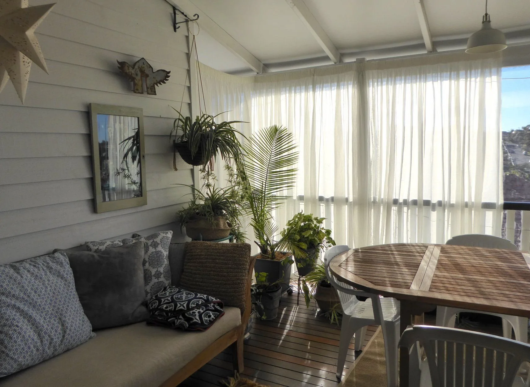 Pencil pleat curtains hung across a bedroom window